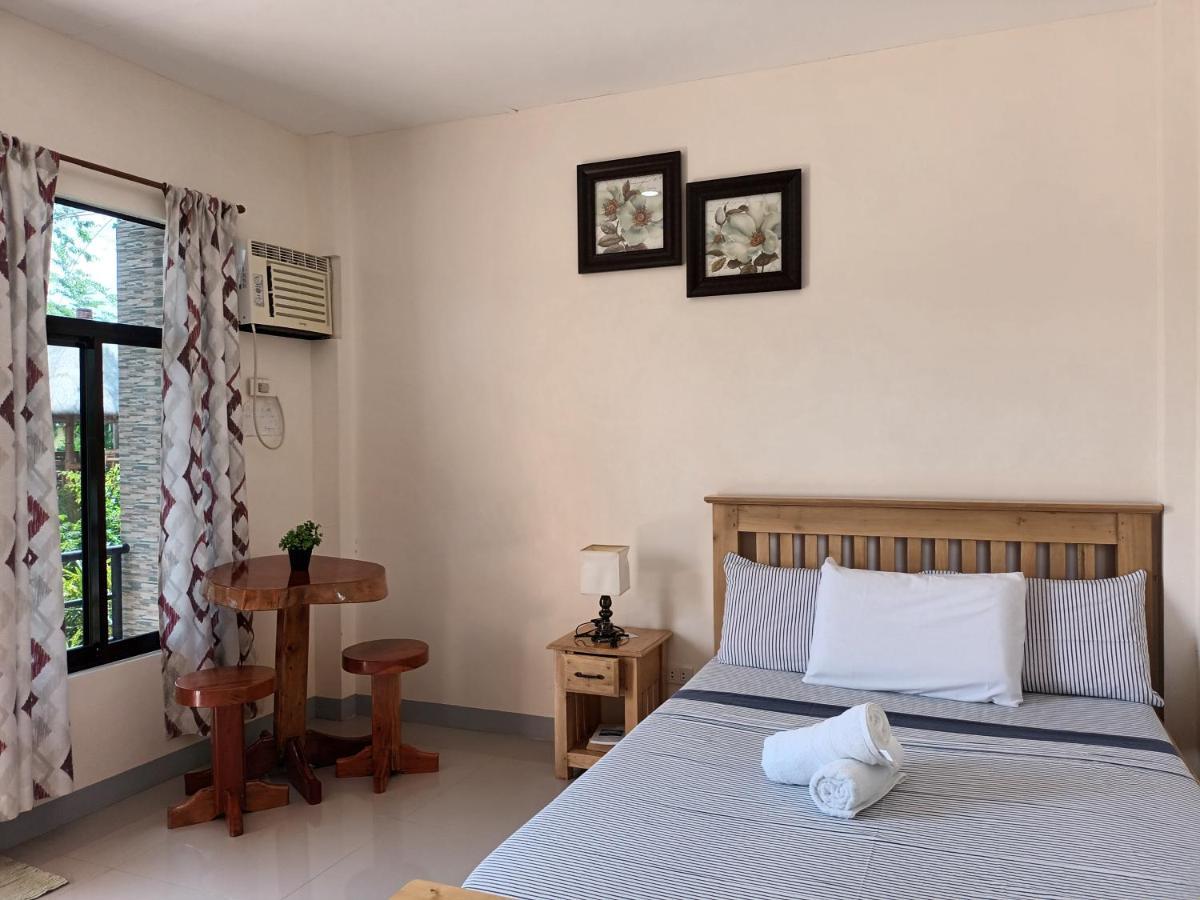 Grae'S Apartelle Moalboal Bagian luar foto