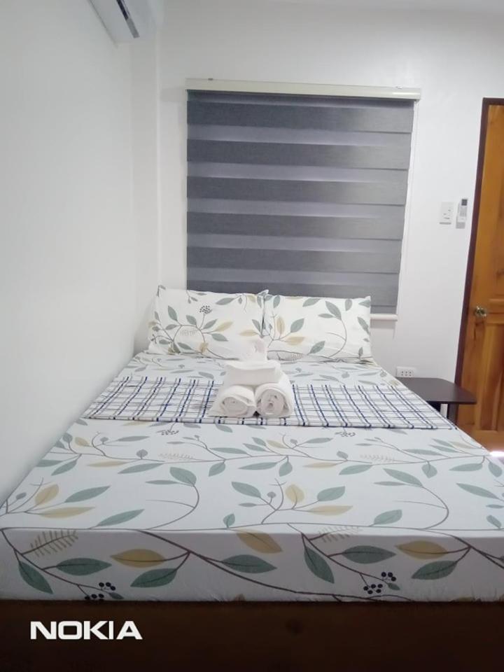 Grae'S Apartelle Moalboal Bagian luar foto